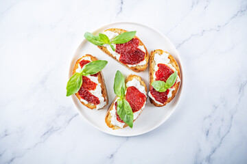 Ricotta dried tomato Basil bruschetta