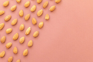 almond nuts pattern on brown background
