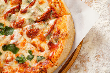 homemade italian pizza on the wooden board