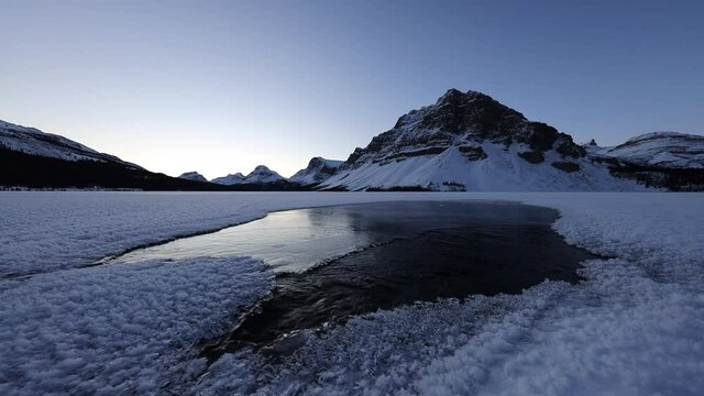 Calm and relaxing, Bow Lake Frozen Icy Water Stream Flowing, Banff National Park, Canadian Rockies, Alberta, Canada