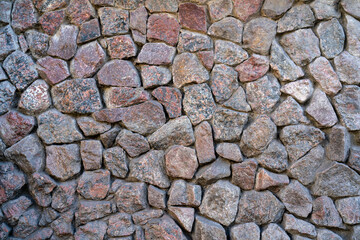 Wall of granite stones. Abstract stone natural background.