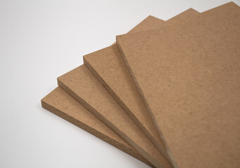 Plates of raw MDF on a white background.