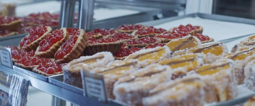 Traditional Portuguese Cake Rolls In Bakery Shop Window. Slow Motion, Close Up.