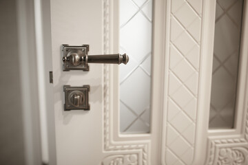 The handle on the room door.