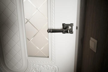 Obraz premium The handle on the room door.
