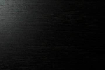 Black surface of wooden background.