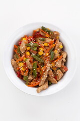 Meat with vegetables and sesame seeds 