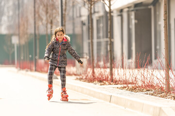 Young happy skater trying exciting outdoor activity