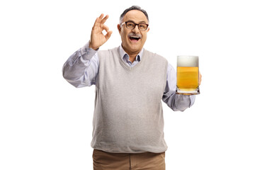 Happy mature man holding a pint of beer and gesturing a good sign