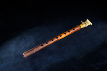 Armenian musical woodwind instrument duduk or tsiranapogh on isolated black background