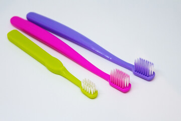 Toothbrushes dental care family set. Two toothbrushes for adults, one for child.