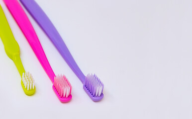Toothbrushes dental care family set. Two toothbrushes for adults, one for child.