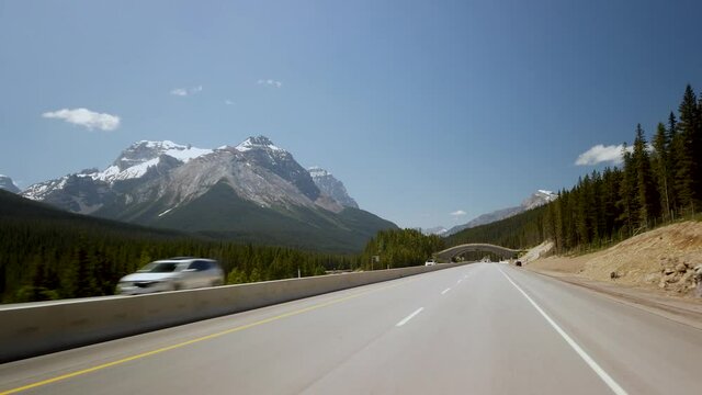 YOHO NATIONAL PARK, BC, CANADA - JULY 2019: Smooth Gimbal Driving on Highway of Yoho National Park in British Columbia, Canada