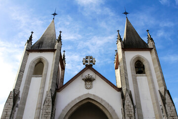 Fototapeta premium Majestic church facade under blue sky