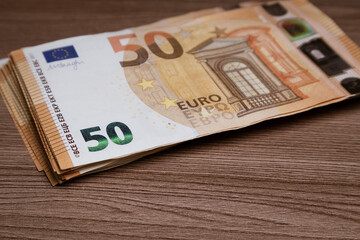 Stack of 50 euro banknotes on the table