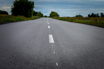 Fototapeta premium Road in the countryside on sunset
