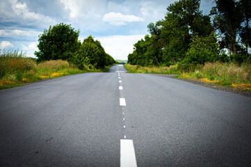 Fototapeta premium Road in the countryside on sunset