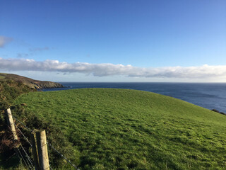 Fototapeta premium View of the Irish Sea from above Port Soderick - a small hamlet to the south of Douglas, capital of the Isle of Man, once famed for its pleasure grounds and beach.
