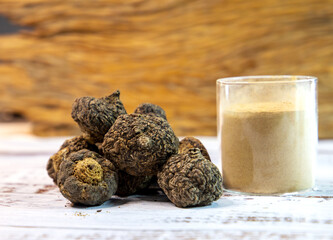 Peruvian maca roots or Peruvian ginseng (lat. Lepidium meyenii) with maca products (maca powder) on...