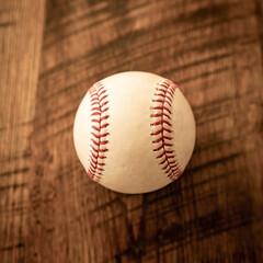 Vintage baseball presented on old wooden bench

