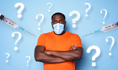 Man with face mask has a lot of questions and doubts about covid 19 vaccine. cyan background
