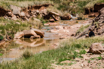 Zaida, Morocco - April 10, 2015. Feeder of the river Moulouya with orange color