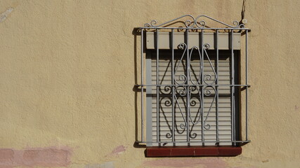 window with lowered shutter and grille