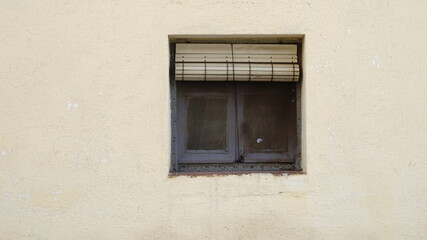 old dirty window with roller shutter