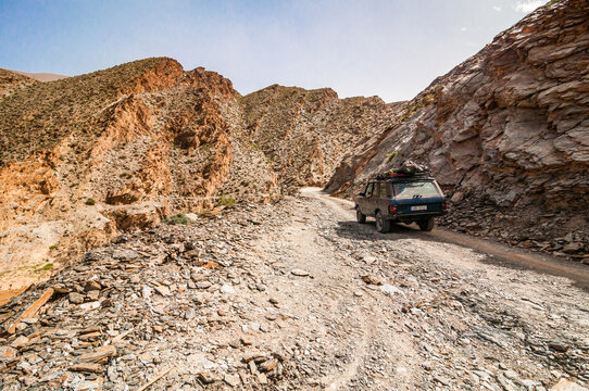 Aouli, Morocco - April 10, 2015. Old vintage Range Rover Classic going in the valley around abandoned mines  