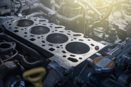 Disassembled car engine without cylinder head. Repair of an old turbocharged diesel engine in a car workshop.