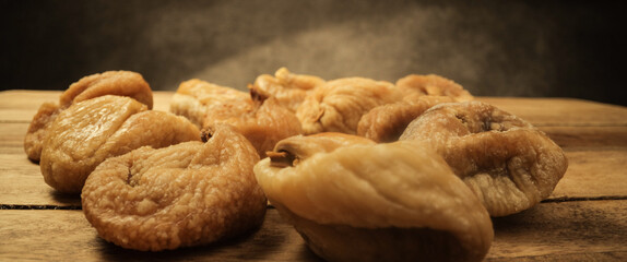 Dried figs on a wooden board - studio photography