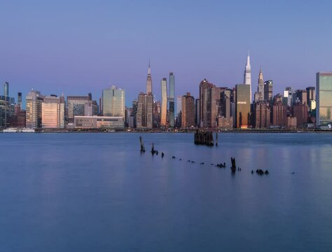 Midtown Manhattan from East River in night to day time lapse
