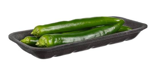 Three green hot chili peppers in dark foam container isolated on white background