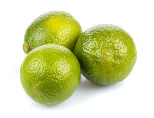 Three ripe limes in a bunch isolated on white background
