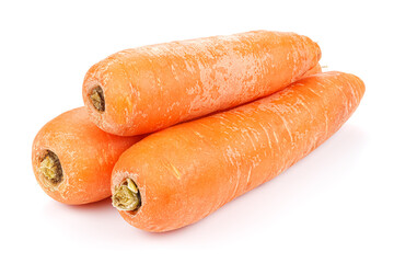 Three fresh washed carrots in stack isolated on white background