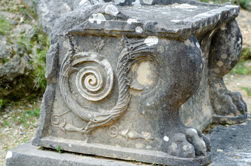 The theatre of the Amphiareion oropos Greece,Close up Marble thrones with relief floral decoration