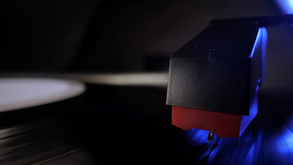 Amazing view over a record player playing a vinyl - studio photography