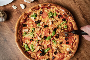 Close-up of an italian pizza with ingredients. Selective focus