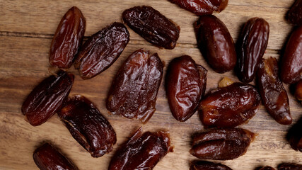 Dried dates on a wooden board - studio photography