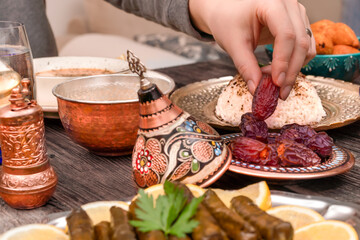 Traditional Turkish dinner include pilaf (boiled rice), lentil soup, Izmir meat balls with potatoes, sarma, kibbeh (aka icli kofte), dried date fruits. Ramadan iftar (evening meal after fasting).