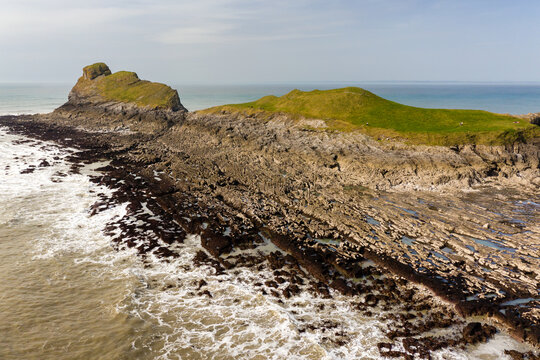 Aerial view of spectacular rocky coastline at low tide (Worm's Head, Wales)