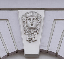 Frescoes, stucco on the facade of the building, city street