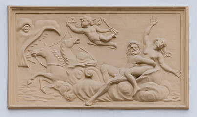 Frescoes, stucco on the facade of the building, city street