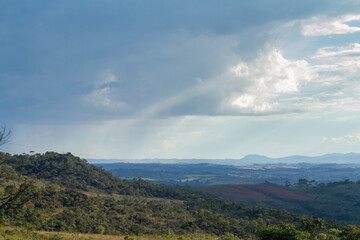 aerial landscape of plantation on farms with blue sky and clouds