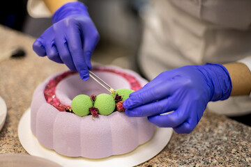 Busy woman professional confectioner decorating sweet delicious pastry cake matcha tea chocolate