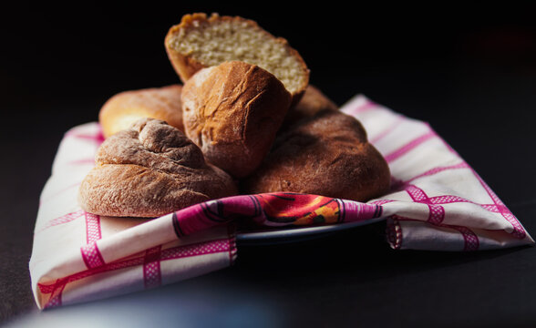 bread on plate with black background
