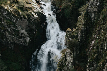 Super close up of a waterfall in the middle of the mountains relax and inspiration concepts with...
