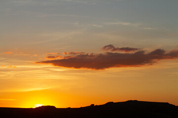 Fototapeta na wymiar sunset with montain chain silhouette