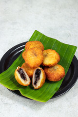 Misro or jemblem or klenyem is Indonesian traditional fritters made from deep fried cassava and filled with palm sugar inside