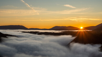 Fototapeta na wymiar foggy sunrise in the mountains